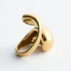 Bague sculpturale à double torsion