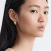 Boucles d&rsquo;oreilles créoles en strass en deux parties