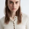 Haut en laine mérinos à demi-patte de boutonnage