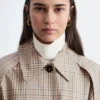 Manteau à carreaux avec ceinture à boucle