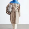 Manteau à carreaux avec ceinture à boucle
