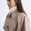 Manteau à carreaux avec ceinture à boucle
