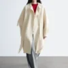 Manteau en laine à franges