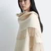 Manteau en laine à franges