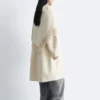 Manteau en laine à franges