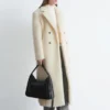 Manteau long en laine et peau de mouton