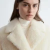 Manteau long en laine et peau de mouton
