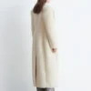 Manteau long en laine et peau de mouton
