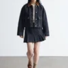 Mini-jupe en denim plissé