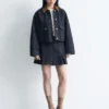Mini-jupe en denim plissé