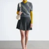 Mini-jupe plissée en laine