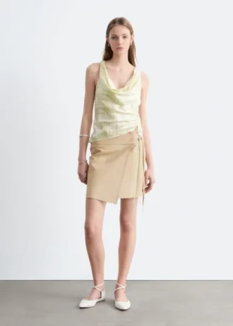 Mini-jupe portefeuille en cuir