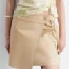 Mini-jupe portefeuille en cuir