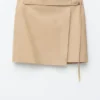 Mini-jupe portefeuille en cuir
