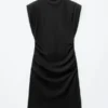 Mini-robe en jersey drapé
