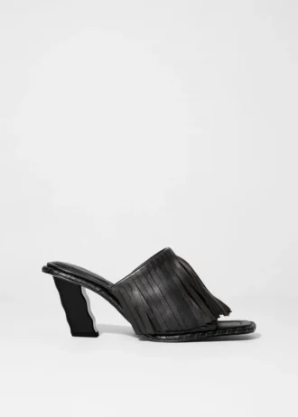 Mules en cuir à franges
