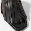 Mules en cuir à franges