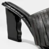 Mules en cuir à franges