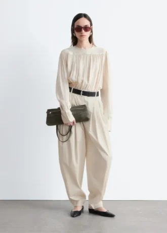 Pantalon à jambes évasées et plis