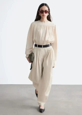 Pantalon à jambes évasées et plis