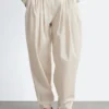 Pantalon à jambes évasées et plis