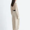 Pantalon à jambes évasées et plis
