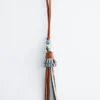Pendentif en cuir à pompon