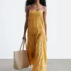 Robe longue à corsage plissé