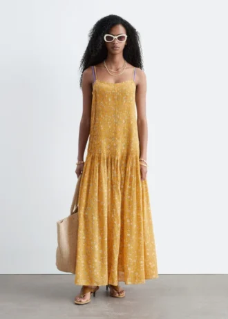 Robe longue à corsage plissé