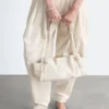 Sac bandoulière en cuir discret