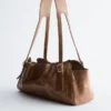 Sac bandoulière en cuir discret