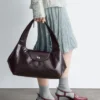 Sac bandoulière en cuir incurvé