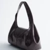Sac bandoulière en cuir incurvé