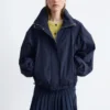 Veste à col montant et cordon de serrage