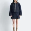 Veste en denim à col en velours côtelé