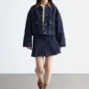 Veste en denim à col en velours côtelé